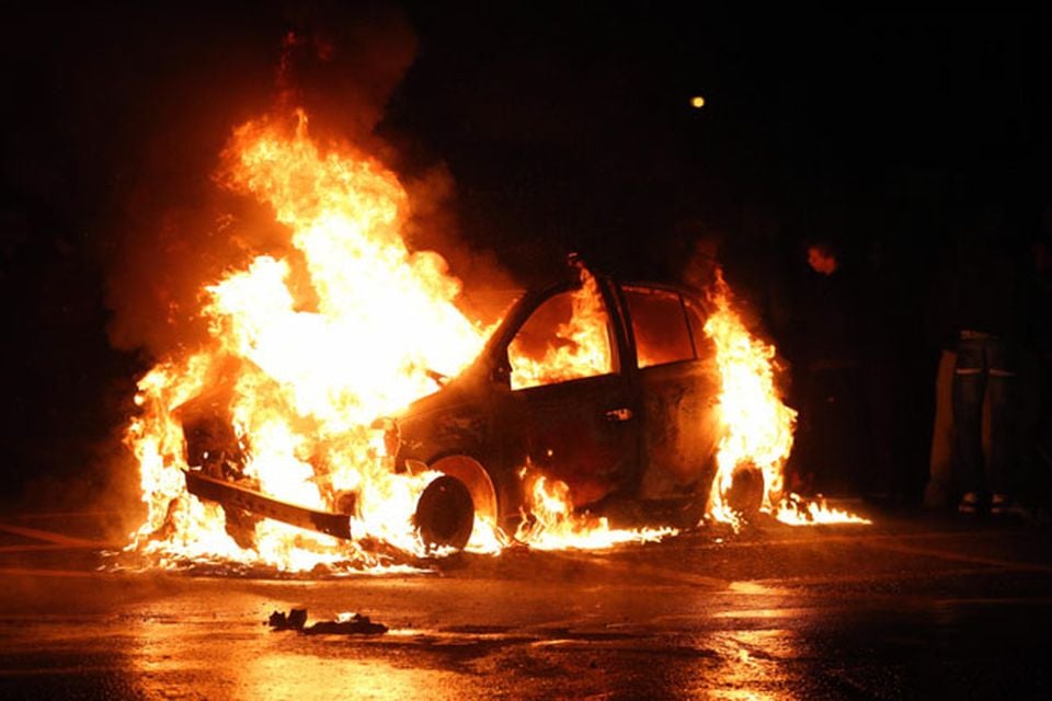 A car burns in the Castlereagh Street of east Belfast