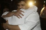 thumbnail: ** ALTERNATE CROP ** Employees of The Taj Hotel comfort each other after they were rescued from the hotel in Mumbai, India, Thursday, Nov. 27, 2008. (AP Photo/Gautam Singh)