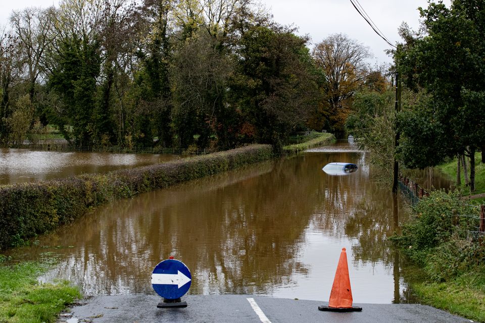 A car is submerged in flood water in the Tirmacrannon Road are of Loughgall following heavy rain overnight on October 30th 2023 (Photo by Kevin Scott for Belfast Telegraph)