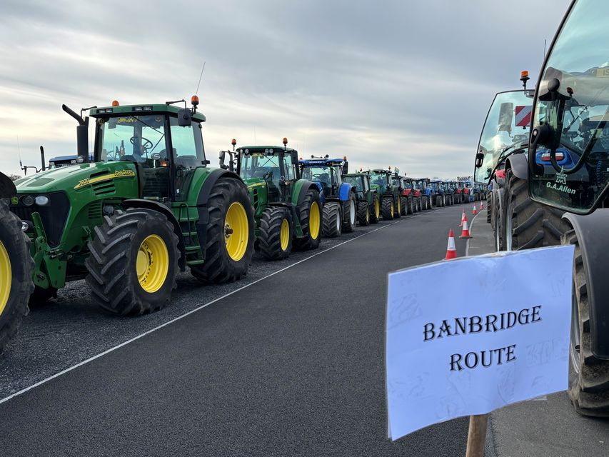 Farmers gather in tractors at the Maze site close to Lisburn, Co Antrim for one of seven protest tractor runs across Northern Ireland (Rebecca Black/PA)