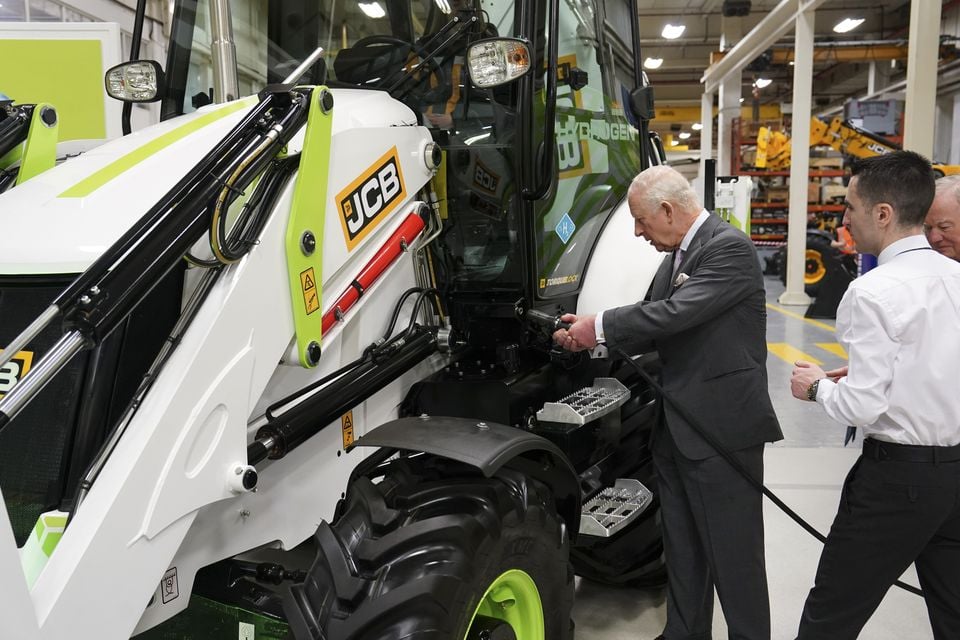 Charles was shown how to refuel JCB’s recently-developed hydrogen-powered combustion engine (Arthur Edwards/The Sun/PA)