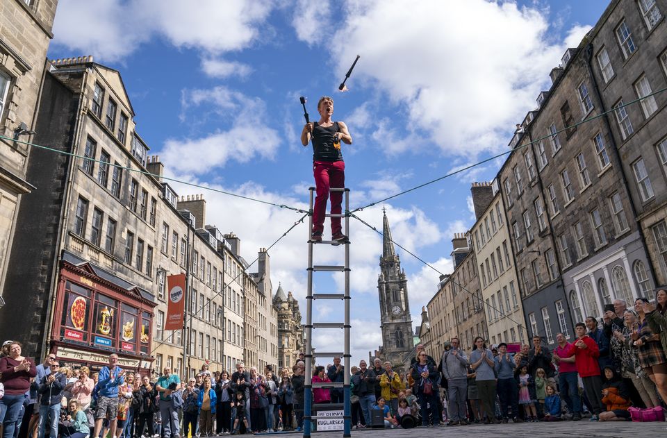 Street performers take to the Royal Mile during the festival (Jane Barlow/PA)