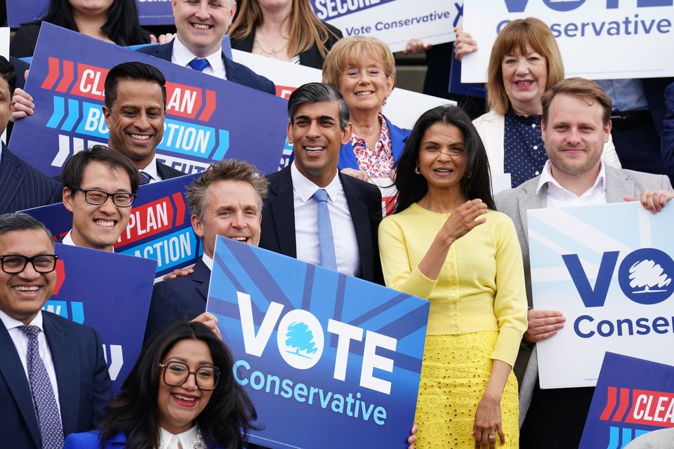 Rishi Sunak with his wife Akshata Murty at the Tory manifesto launch (James Manning/PA)