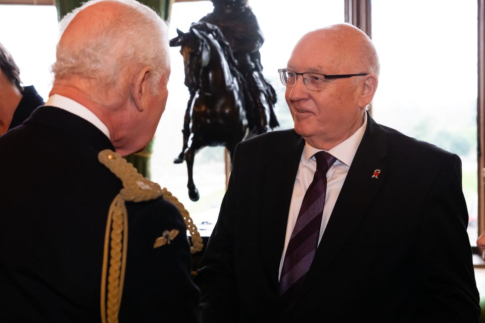 King Charles III presents an Elizabeth Emblem to Paul Bone, for Police Constable Fiona Bone who served with Greater Manchester Police (Aaron Chown/PA)