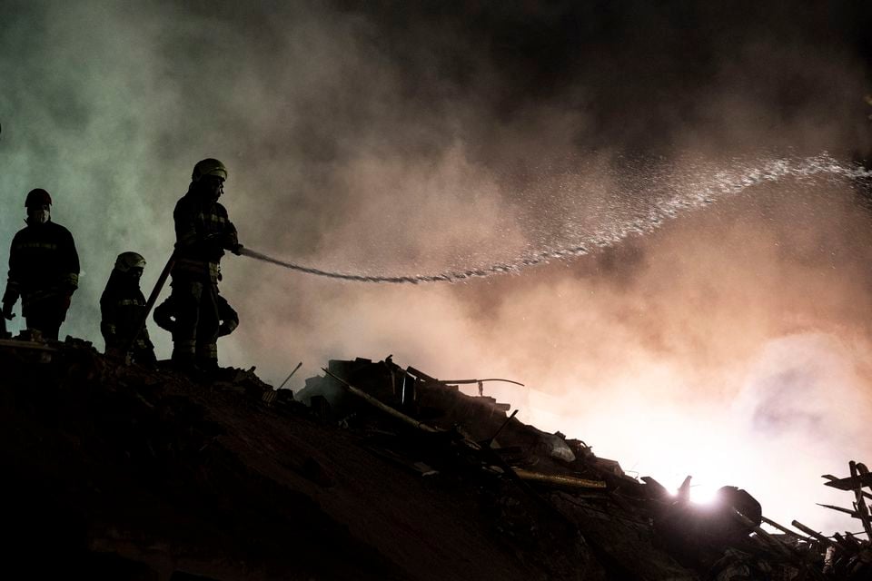 Firefighters work in the ruins of a building that collapsed in the city of Konya (Ugur Yildirim/Dia Photo via AP)