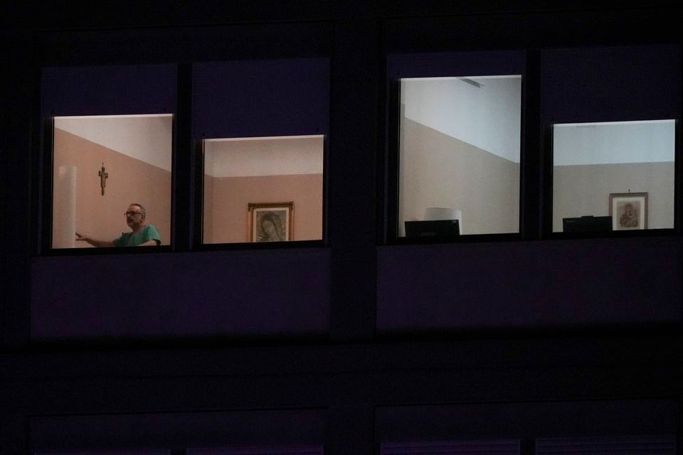 A man walks in the ward where Pope Francis is being treated at the Agostino Gemelli Polyclinic in Rome (Andrew Medichini/AP)