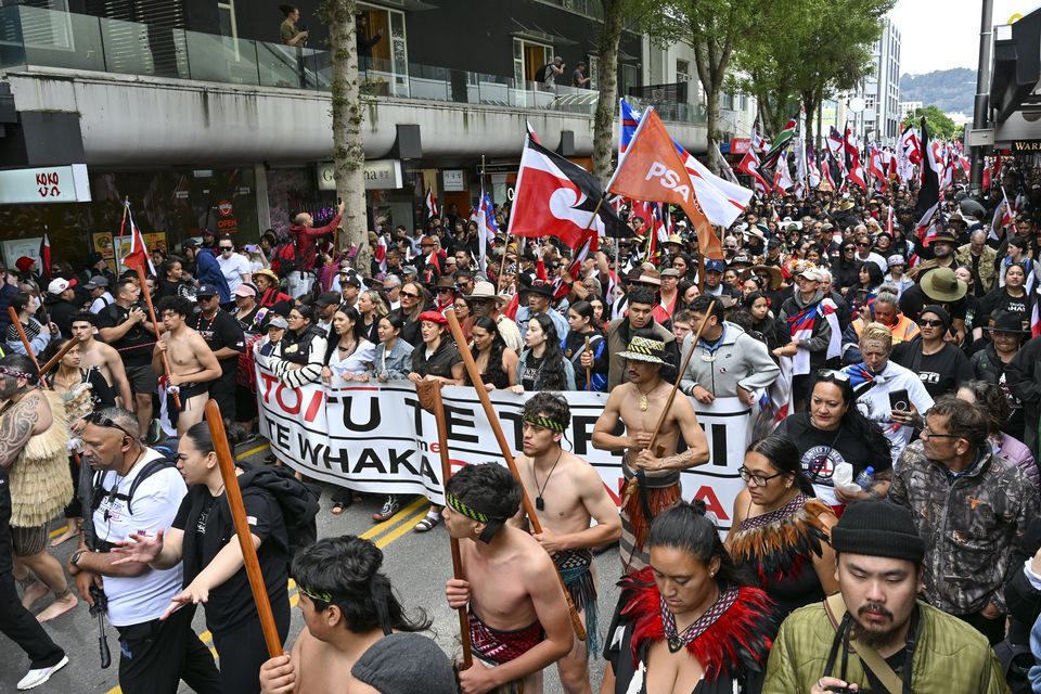 NZ’s Maori people march through the central business district (Mark Tantrum/AP)