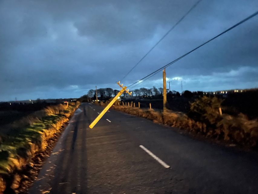 A broken telegraph pole in Blaris Road, Co Antrim (Jonathan McCambridge/PA)