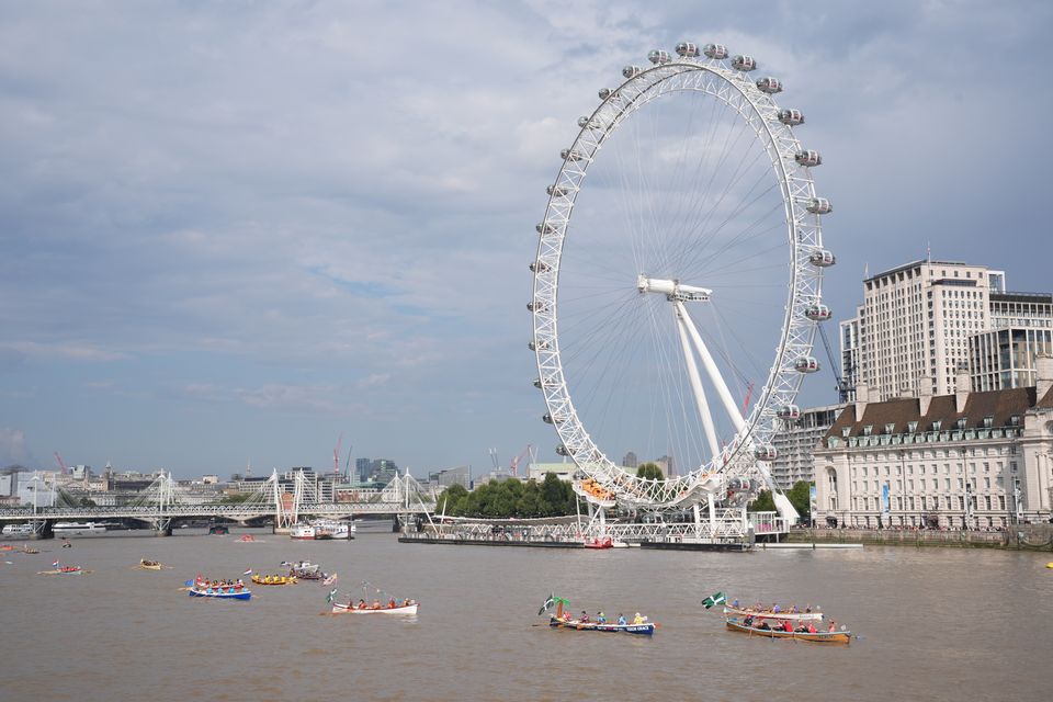 Boats pass the London Eye (Lucy North/PA)