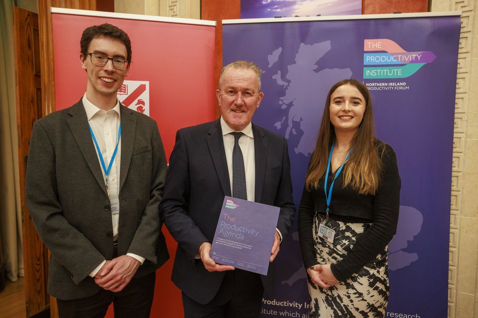 Economy Minister Conor Murphy (centre) with Dr David Jordan and Ruth Donaldson, from The Productivity Centre at Queen’s University Belfast’s Business School (Liam McBurney/PA)