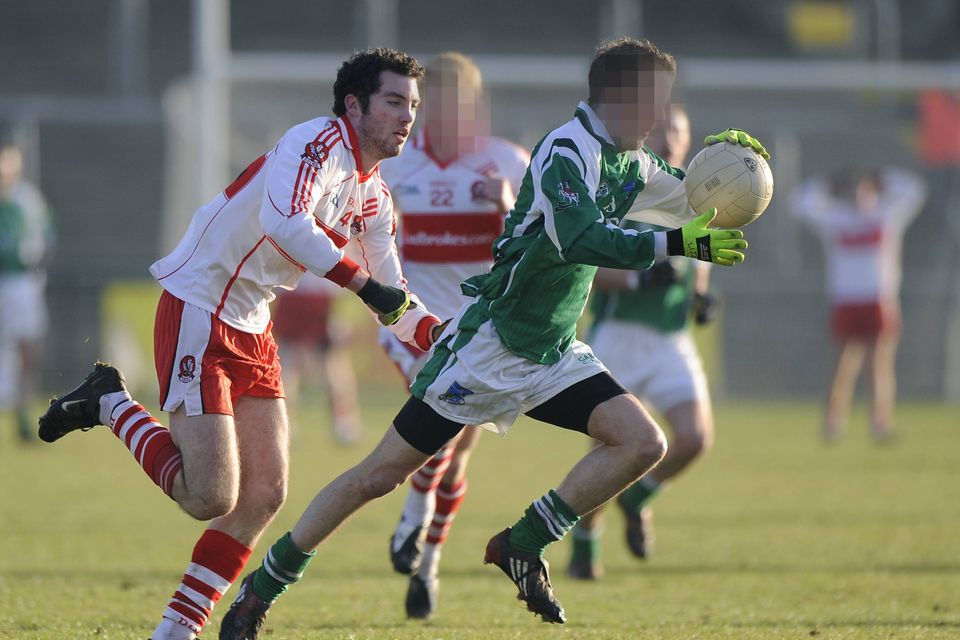 Niall Bradley (left) in action for Derry in January 2009