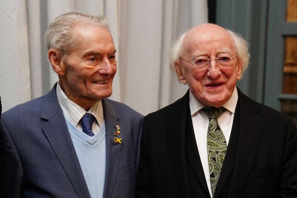 Irish President Michael D Higgins with Holocaust survivor Tomi Reichenthal (Brian Lawless/PA)