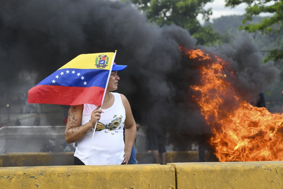 Protesters demonstrate against the official election results in Valencia, Venezuela (Jacinto Oliveros/AP)