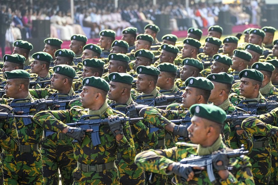 Members of the Sri Lanka’s police special task force march during the country’s Independence Day ceremony (Eranga Jayawardena/AP)