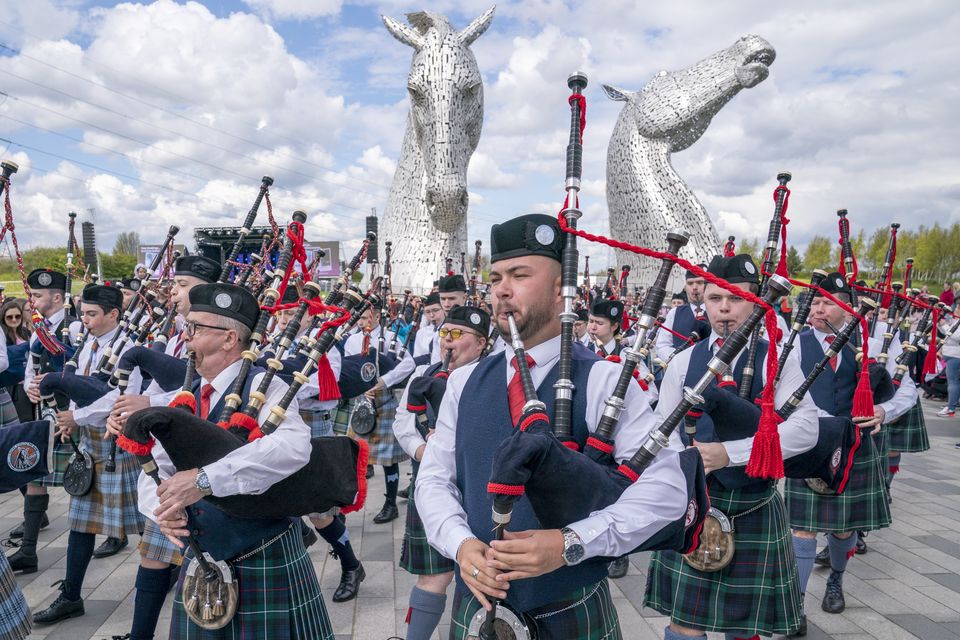 Pipe bands play during a special event day to celebrate the 10th anniversary of the Kelpies sculpture in Falkirk in April (Jane Barlow/PA)