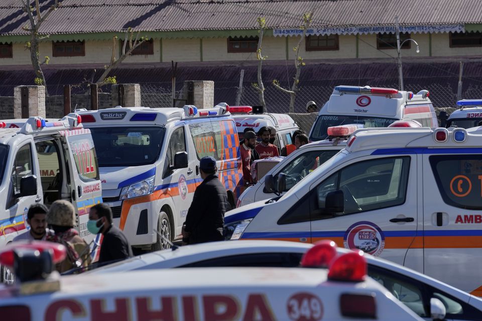 Ambulances waited at the railway station in Much for the bodies of victims of the attack to arrive (Anjum Naveed/AP)