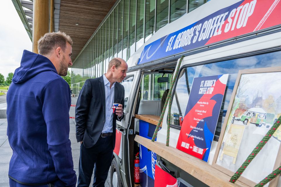 England captain Harry Kane stands with the Prince of Wales as he gets a coffee during a visit to St George’s Park (Paul Cooper/Daily Telegraph/PA)