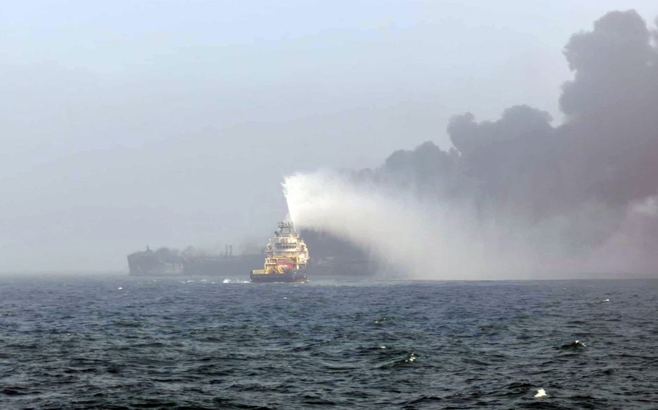 Black smoke billowing into the air after a crash between an oil tanker and a cargo ship off the coast of East Yorkshire (Bartek Smialek)