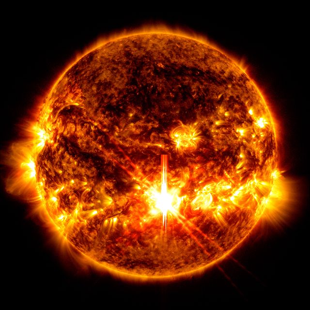 The X9.0 solar flare – seen as a bright flash in the centre of the sun (Nasa/SDO)