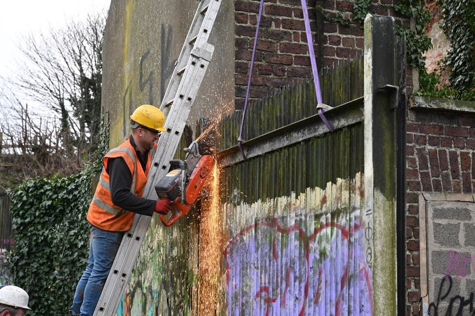 Contractors remove the interface at Water Street, Portadown. Picture: Michael Cooper