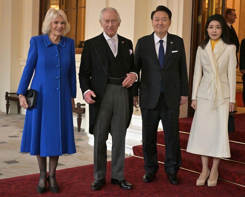 The King and Queen pose with the President of South Korea, Yoon Suk Yeol, and his wife, Kim Keon Hee, during the 2023 state visit (Ben Stansall/PA)