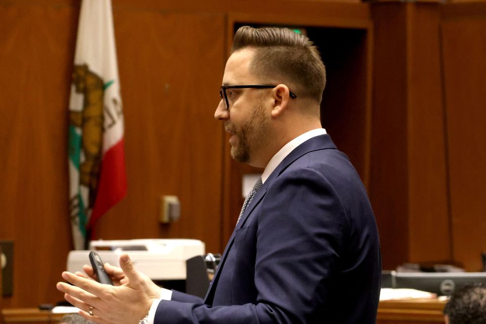 Los Angeles Deputy District Attorney Paul Przelomiec makes his opening remarks as defence attorney Joe Tacopina, centre, and his client, Rakim Mayers, aka ASAP Rocky, right, listen in (Genaro Molina/Los Angeles Times via AP)