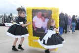 thumbnail: Wreaths are carried to the graveside by young mourners at the funeral of 'Queen of Travellers' Violet Crumlish. Picture by Jonathan Porter/Press Eye