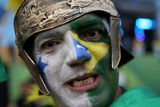 thumbnail: RIO DE JANEIRO, BRAZIL - JUNE 23:  A Brazilian soccer fan waits for their team to play against Cameroon at the FIFA Fan Fest on Copacabana beach June 23, 2014 in Rio de Janeiro, Brazil.  (Photo by Joe Raedle/Getty Images)