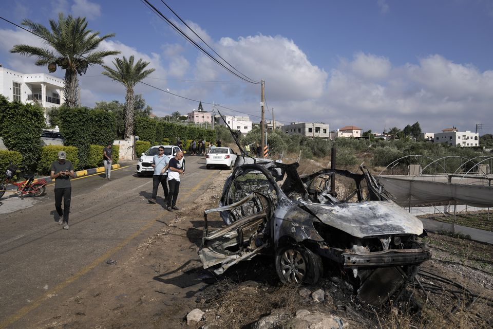 The Israeli military says it struck five suspected terrorists in a vehicle on their way to carry out an attack (Majdi Mohammed/AP)