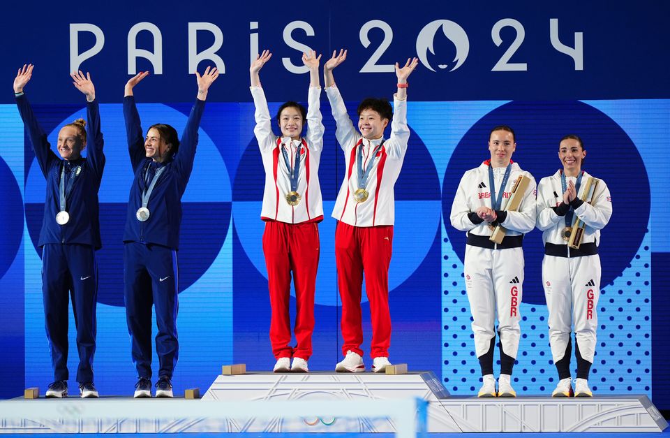 The medallists at the Aquatics Centre in Paris (Mike Egerton/PA)