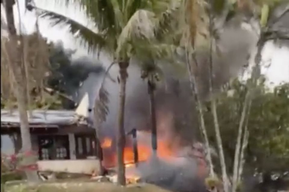 Fire coming from a plane that crashed by a home in Vinhedo, Sao Paulo state, Brazil (Felipe Magalhaes Filho via AP)