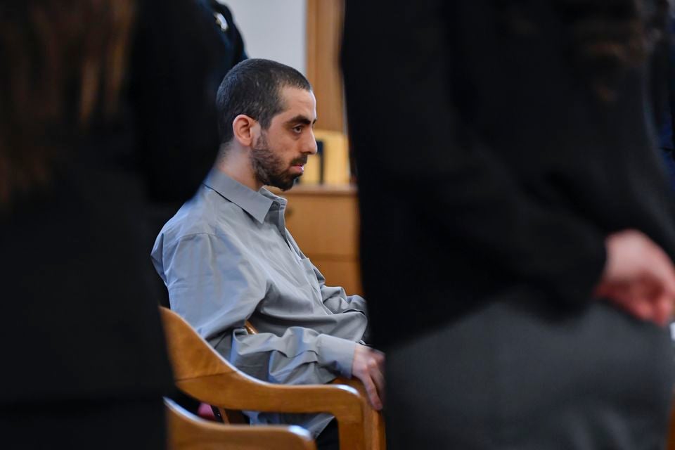 Hadi Matar, accused of repeatedly stabbing Salman Rushdie as the renowned author was being introduced for a lecture in New York, sits in court (AP)