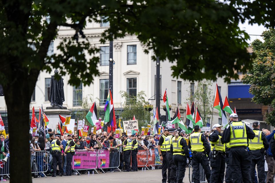 Activists from Stand Up To Racism Scotland gather in Glasgow’s George Square, in a counter protest to a far-right rally (Jane Barlow/PA)