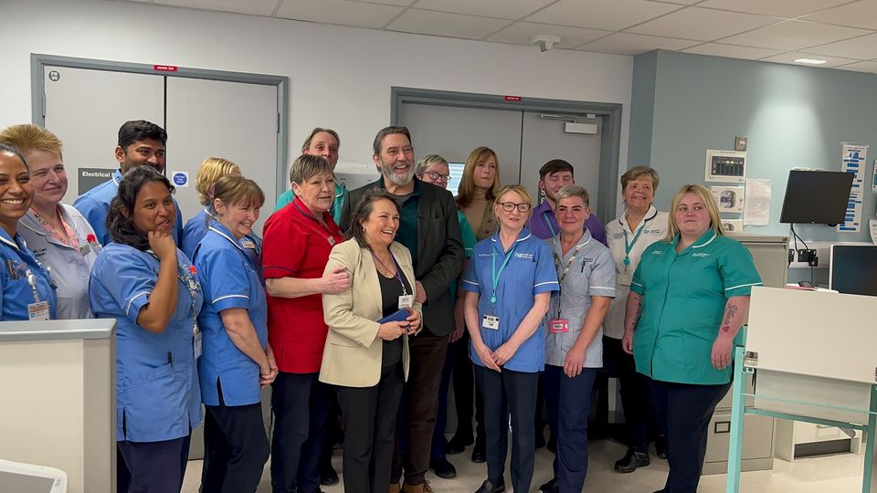 Oscar-nominated actor Ciaran Hinds with the staff at Whiteabbey Hospital