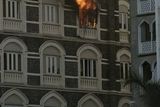 thumbnail: Flames come from a room of the Taj Mahal hotel in Mumbai, India, Thursday, Nov. 27, 2008. Black-clad Indian commandoes raided two luxury hotels to try to free hostages Thursday, and explosions and gunshots shook India's financial capital a day after suspected Muslim militants killed people. (AP Photo/Gurinder Osan)
