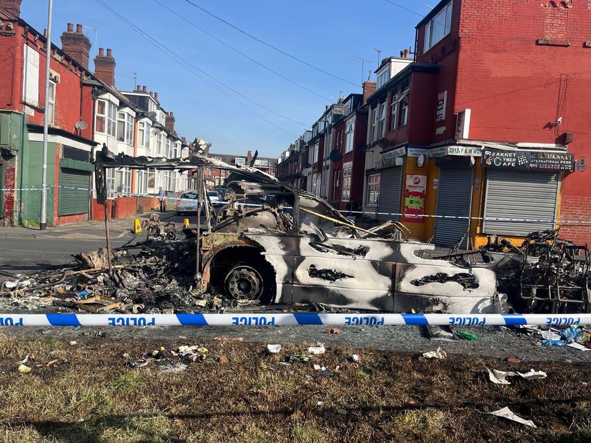 Vehicles were set on fire and a police car was overturned (Katie Dickinson/PA)