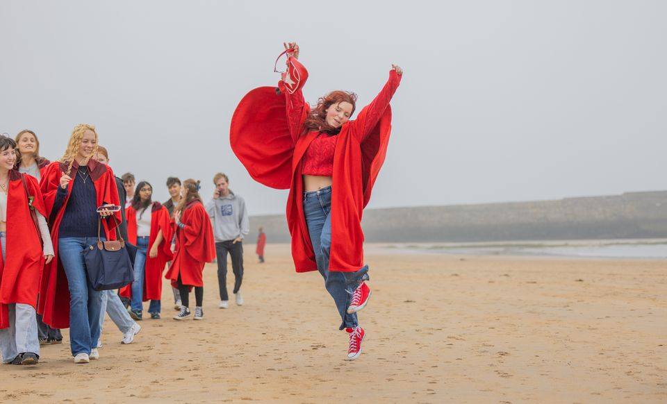 Students celebrate the start of the new term on East Sands (University of St Andrews/PA)