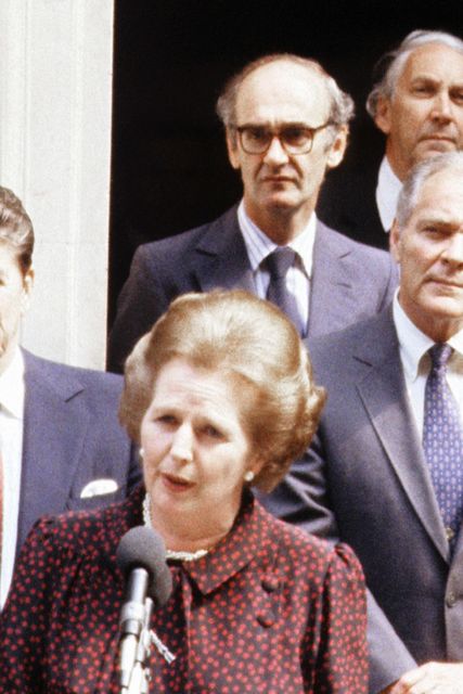 Margaret Thatcher with John Nott behind her in Downing Street (PA)