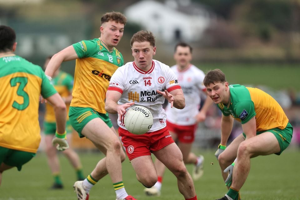 Mark Bradley attenpts to lead the Tyrone charge