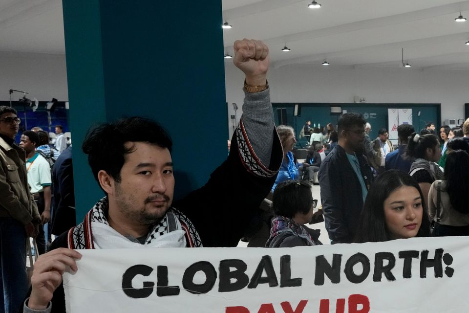 Activists demonstrate for climate finance at the Cop29 UN Climate Summit (AP Photo/Rafiq Maqbool)