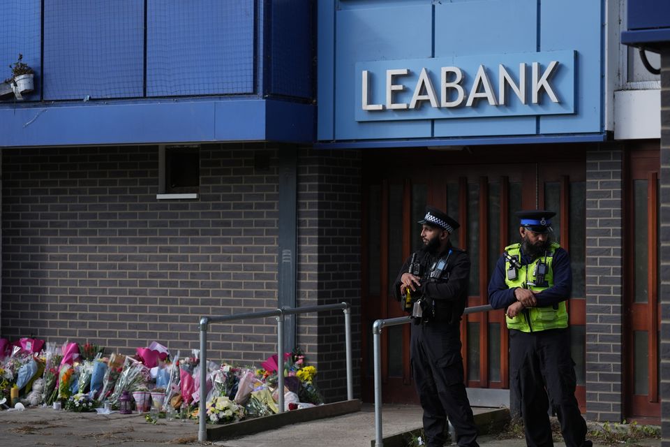 Police officers at Leabank in Luton, Bedfordshire, where the three victims were killed (Jacob King/PA)