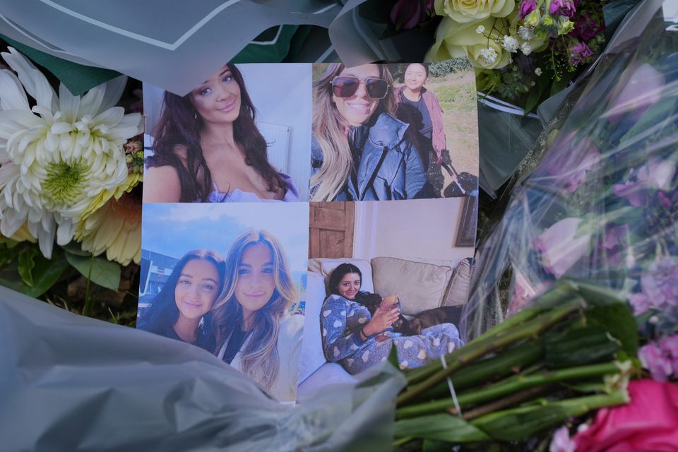 Pictures and floral tributes at Ashlyn Close (Jonathan Brady/ PA)