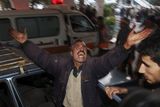 thumbnail: A Palestinian man reacts after bringing his children who were wounded in an Israeli army incursion into hospital in Gaza City, Monday, Jan. 5, 2009. Israel seized control of high-rise buildings and attacked houses, mosques and smuggling tunnels as it pressed forward with its offensive against the Gaza Strip's Hamas rulers on Monday, even as a stream of European leaders headed for the region to press for a truce. (AP Photo/Khalil Hamra)