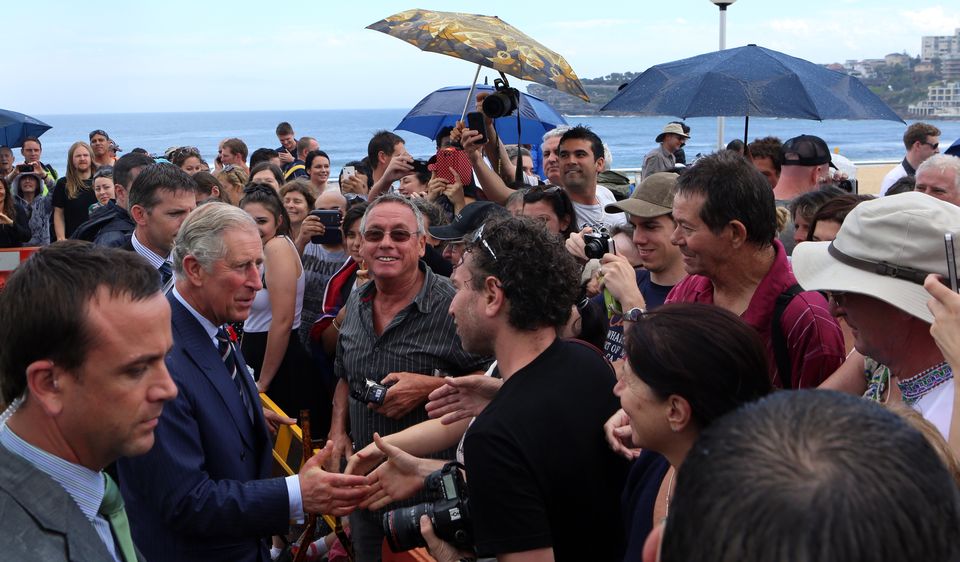 Charles is greeted by wellwishers as he arrives to watch the Australian National Rugby League’s Dream Believe Achieve mentoring programme in action at the Bondi Beach Surf Lifesaving Club in Sydney in 2012 (Chris Radburn/PA)