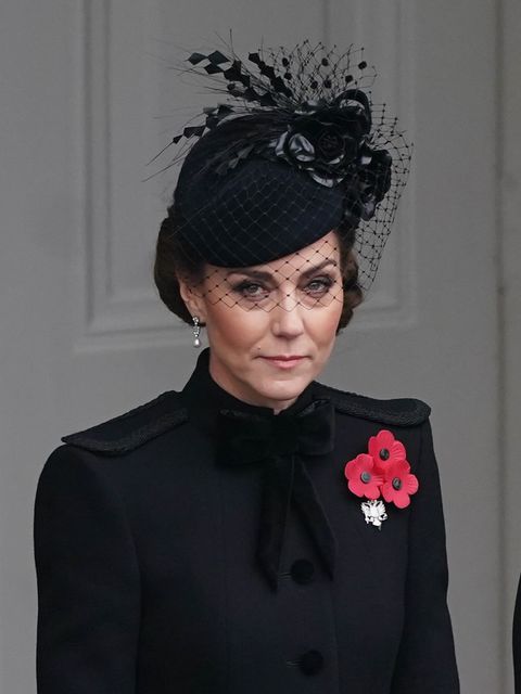 The Princess of Wales wore a netted hat, with her hair in a twisted chignon, and a military-style coat (Stefan Rousseau/PA)