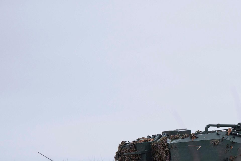 A Ukrainian self-propelled howitzer Dita of the Azov brigade rides to firing position on the frontline (Evgeniy Maloletka/AP)