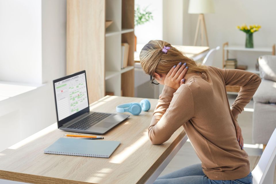 Be conscious about your posture at work (Alamy/PA)