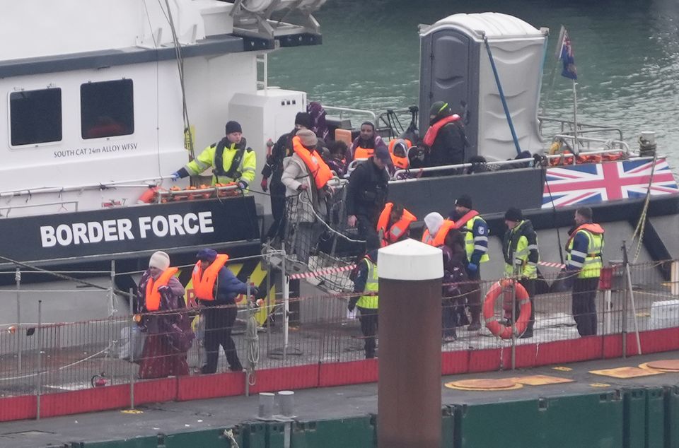 A group of people thought to be migrants are brought in to Dover, Kent, from a Border Force vessel following a small boat incident in the Channel (Gareth Fuller/PA)