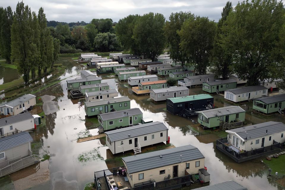 Floodwater around properties at Billing Aquadrome holiday park in Northamptonshire at the end of September (Joe Giddens/PA)