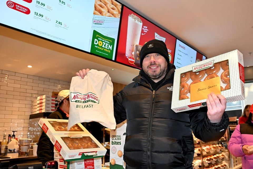 First through the door at the opening of Krispy Kreme Victoria Square Belfast was Francis Downey who queued for 13  hours and won a years’ supply of the iconic doughnuts (Presseye/Stephen Hamilton)